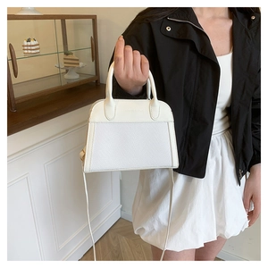 Detail of white PU leather and woven texture tote bag with Fashion & Bags embossing
