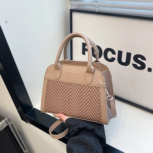 Chic two-tone handbag with beige faux leather and brown herringbone fabric textures