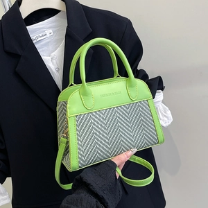 Contrast stitching crossbody bag with green leather trim and herringbone woven pattern