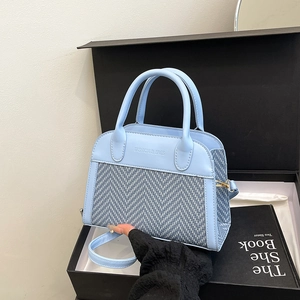 Light blue contrast stitching handbag and crossbody bag shown in a luxury gift box set