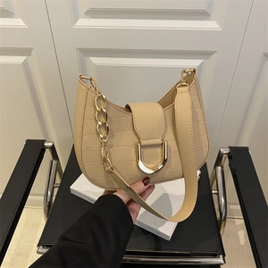 Vintage beige crocodile pattern crescent bag with golden D-clasp and dual straps