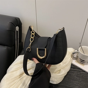 Retro black croc-effect crescent bag with gold U-buckle and elegant chain strap