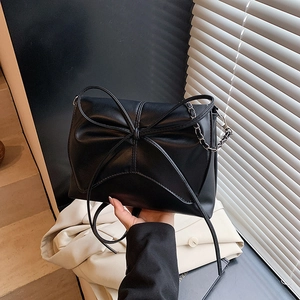 Fashionable black PU leather shoulder bag with a large bow and silver chain strap