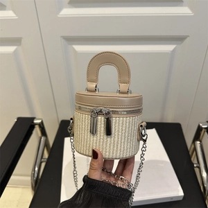 Mini cream bucket bag in woven fabric with leather trim and silver chain strap
