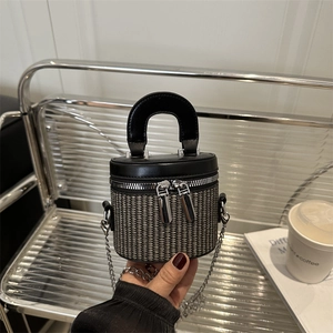 Chic woven bucket bag with dual zippers, leather handle and silver chain strap