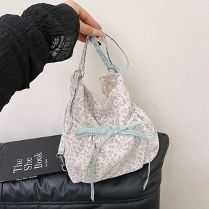 Floral canvas shoulder bag with a light blue bow and pink flower patterns for women