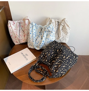 Detail of four floral bubble textured nylon tote bags with drawstring and adjustable straps
