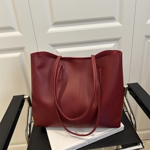 Minimalist deep red leather tote bag with vertical stitching and large capacity