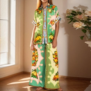 Detailed view of Mediterranean lemon print and silk texture on women's pajama set