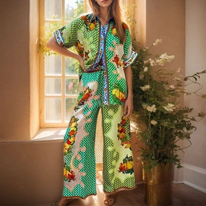 Detailed pattern of colorful fruit and green polka dots on vacation style set