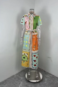 Detail of shirt-style dress with poker card print, buttoned front and waist tie
