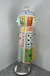 Detail of a short sleeve dress featuring colorful poker card patterns and a matching waist belt