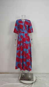Detailed view of the elegant V-neck maxi dress featuring a bold red and blue floral print.