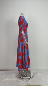 Side view detail of a blue and red floral maxi dress shown on a transparent mannequin