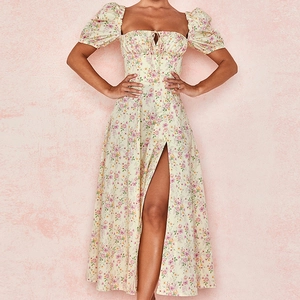 Detail of floral puff sleeve dress with side slit and drawstring milkmaid waistline