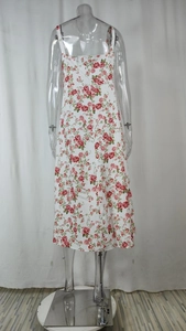 Detailed back view of a floral midi dress with roses and hidden zipper on a white base