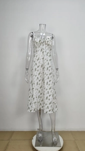 Detail of floral print summer dress with spaghetti straps and ruched bust tie