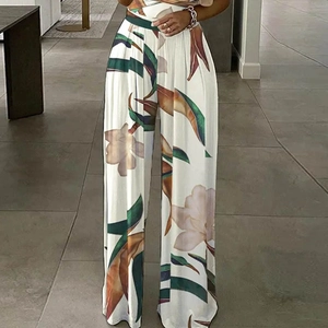 Elegante tuta con stampa floreale a vita alta e gamba larga in bianco con motivo tropicale