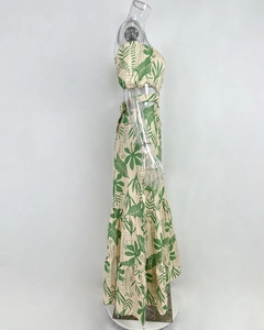 Detail of two-piece tropical leaf print set with cropped top and tiered maxi skirt