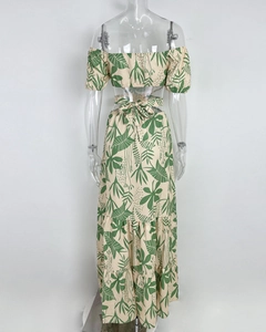 Detail of tropical print two-piece set with off-shoulder top and layered maxi skirt