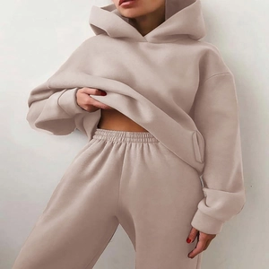 Detailed texture of thick beige cotton hoodie fabric with high-quality stitching