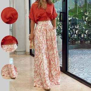 Women's 2-piece set with V-neck orange crop shirt and floral wide-leg pants