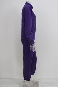 Detail view of purple women's fleece sports set showing fabric texture and side stitching
