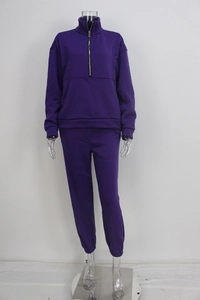 Detail of purple street-style fleece sweatshirt and joggers set on transparent mannequin