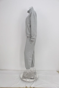 Side view of gray fleece sportswear set with quarter-zip sweatshirt and jogger pants