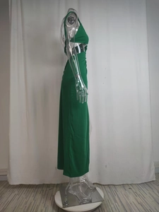 Detail view of the elegant dark green slim-fit maxi dress featuring a high side slit