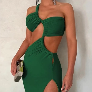 Detail of dark green one-shoulder dress featuring cutout waist and elegant side slit