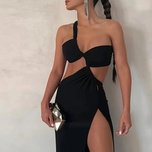 Detail of elegant black one-shoulder dress with cutout waist and high slit design