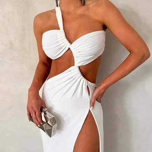 Detail of white asymmetric cutout evening dress featuring a high side slit design