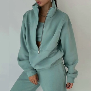 Close-up of mint green half-zip sweatshirt set with high-quality fabric texture