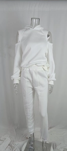 Detail of white cold shoulder hoodie and matching joggers with vertical seam stitching