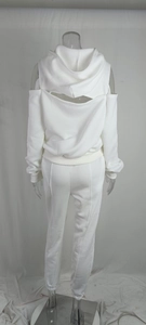Back view of white tracksuit featuring unique cutout shoulders and ribbed joggers details