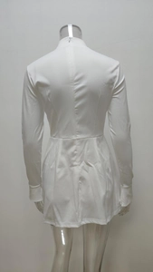 Back view of white long sleeve mini dress featuring hidden zipper and slit cuffs