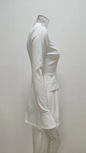 Detail of elegant white long sleeve slim dress featuring a high collar and side pocket flaps