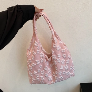Pink floral popcorn textured tote bag with minimalist aesthetic and top handles