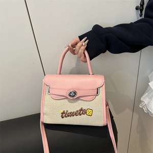 Pink canvas patchwork small crossbody bag with cartoon embroidery and metal turn-lock