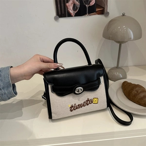Canvas and black leather patchwork crossbody Kelly bag with timeto embroidery and metal lock