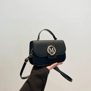 Fashionable black crossbody bag with lizard pattern texture and gold 'M' metal logo