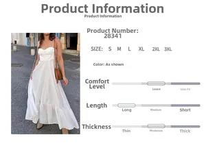Détails d'une robe longue bohème blanche à taille haute avec jupon à volants et bretelles