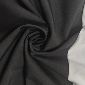 Close-up of elegant black textile fabric with smooth texture and soft matte finish