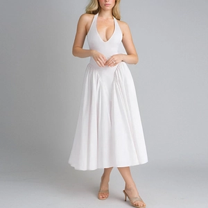 Detail of elegant white halter neck dress with V-neckline and pleated midi skirt