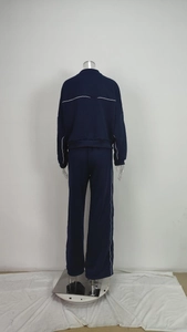 Detail of dark blue loungewear set showing white contrast piping on the back and side seams