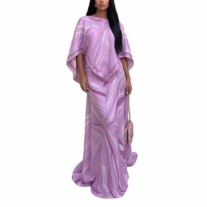 Elegant two-piece purple marble print set featuring a cape top and flowing maxi skirt