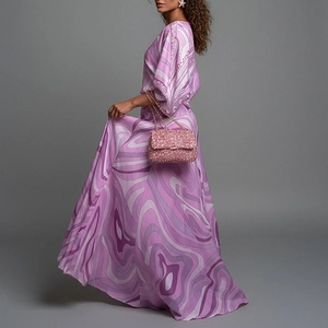 Women's two-piece set with purple and pink marble print maxi dress and sequin bag