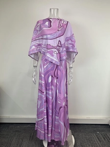 Detail of the abstract geometric pattern on the purple silk-like fabric of the two-piece set