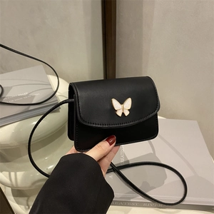 Mini black leather crossbody bag with white shell butterfly hardware and gold trim
